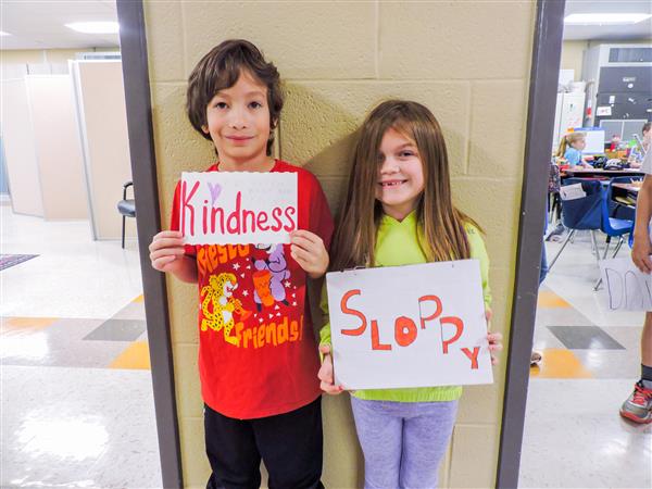 Students and teachers dressing up for a vocabulary parade. 